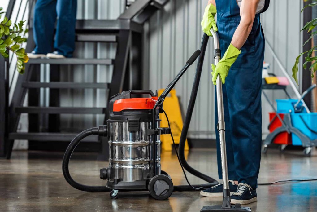cropped-view-of-cleaner-in-uniform-cleaning-floor-with-vacuum-cleaner.jpg